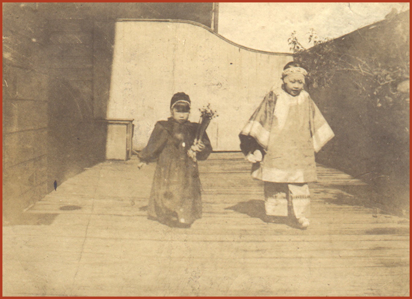 Gertrude Tape and her friend walking together.