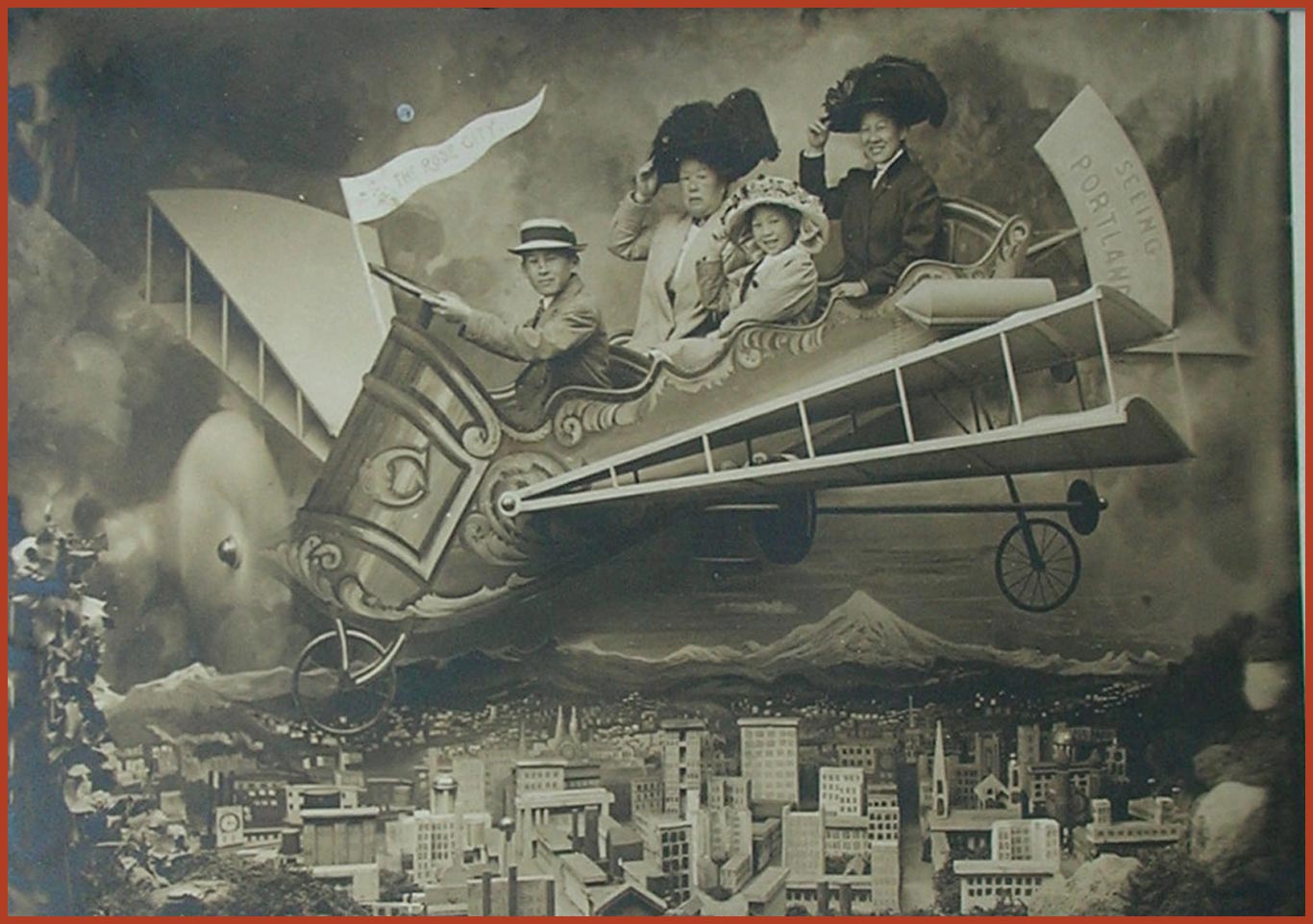 Posing for a tourist postcard, Mamie (right) with children, Emily and Harold, and sister Emily. Captaured in black and white, they are sat in a plane holding onto their hats.