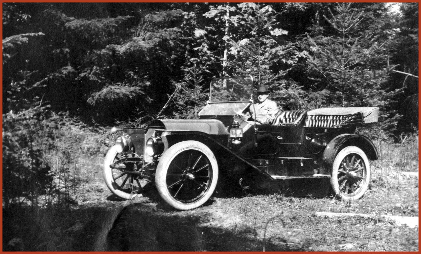Frank Tape sitting in his Kissel automobile.