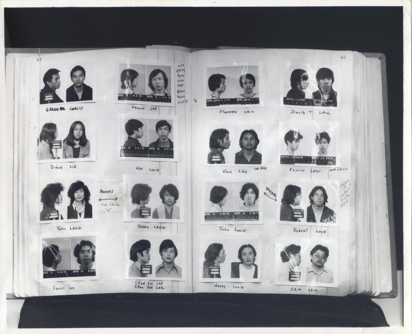 Open book with two columns of mugshots on each page.