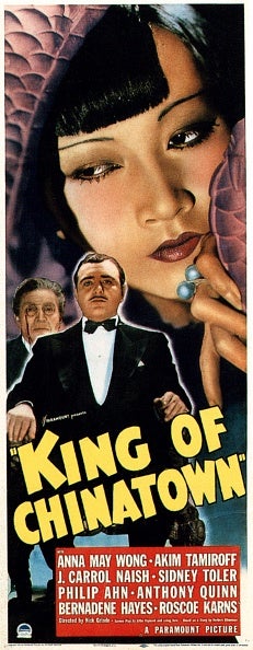 A King of Chinatown poster shows Anna May Wong on top as Akim Tamiroff and J. Carrol Naish are sitting on a chair at the bottom left.