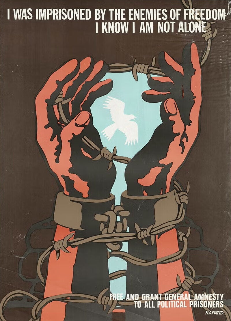 Illustration of barbed wire around shackled hands framing a dove in the sky. Text: I was imprisoned by the enemies of freedom, I know I'm not alone.
