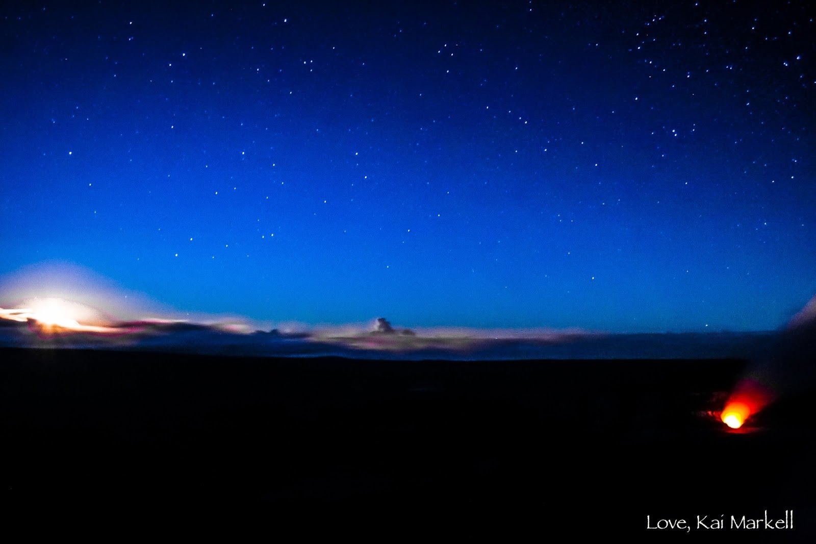 A mountain named Mauna A Wākea is shown under a sky full of stars and a sunrise on the left.