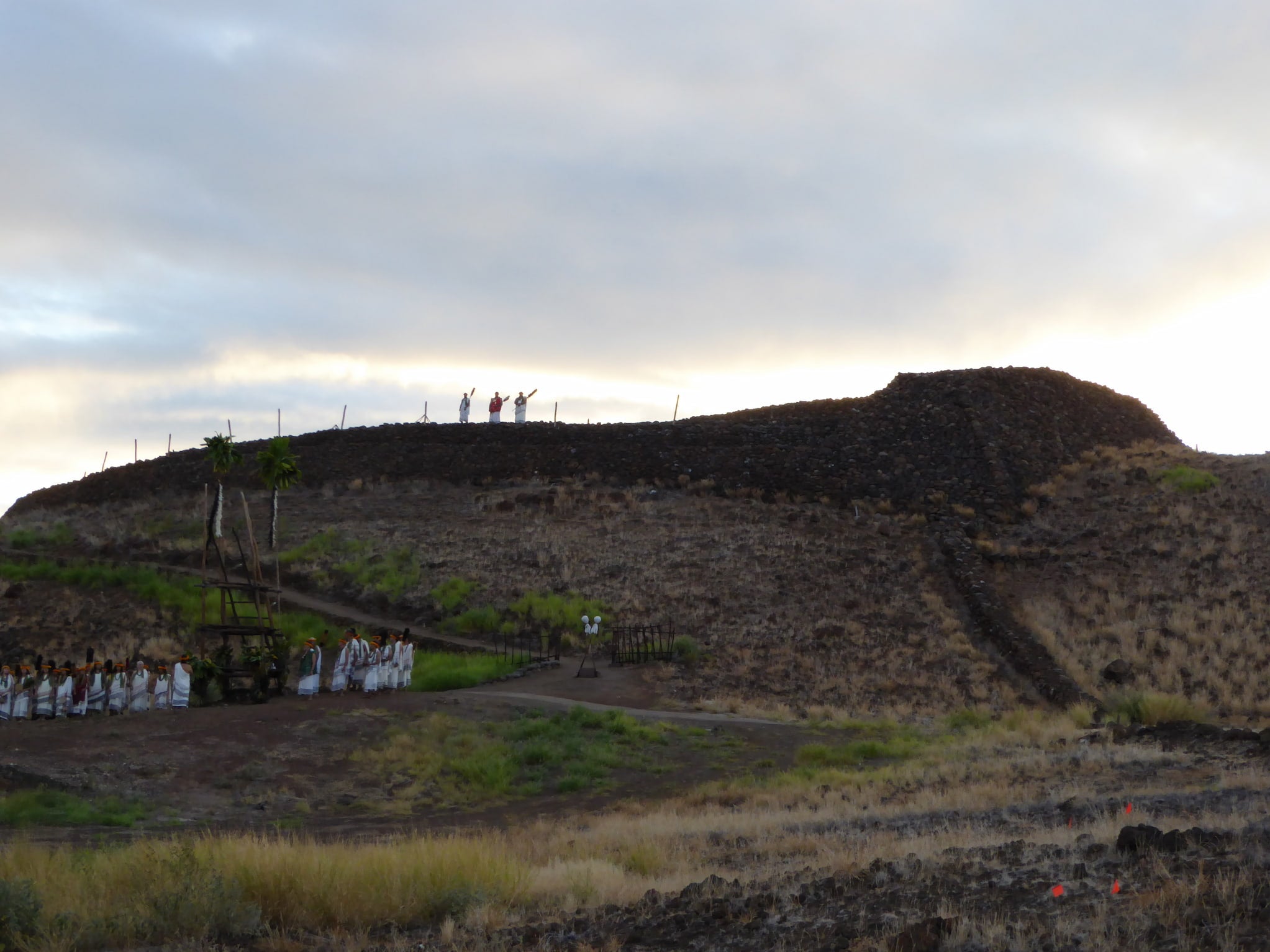 At sunrise, a ceremony to reunify descendants of Kamehameha and Keouakūahuʻula is held around the hill of Puʻukohola Heiau on the island of Hawai'i.