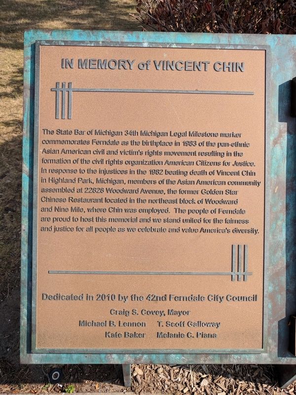 Outdoor plaque with inscription "In Memory of Vincent Chin" at top. Text below describes significance of plaque's location and commemoration details.