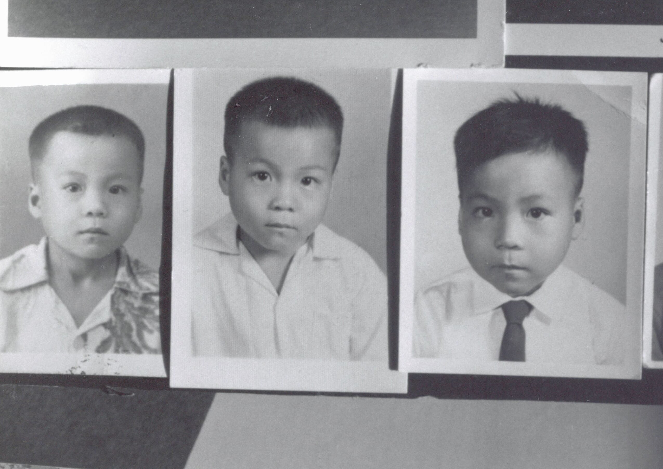 Three printed black and white photos, arranged side by side, show Vincent Chin as a young child.
