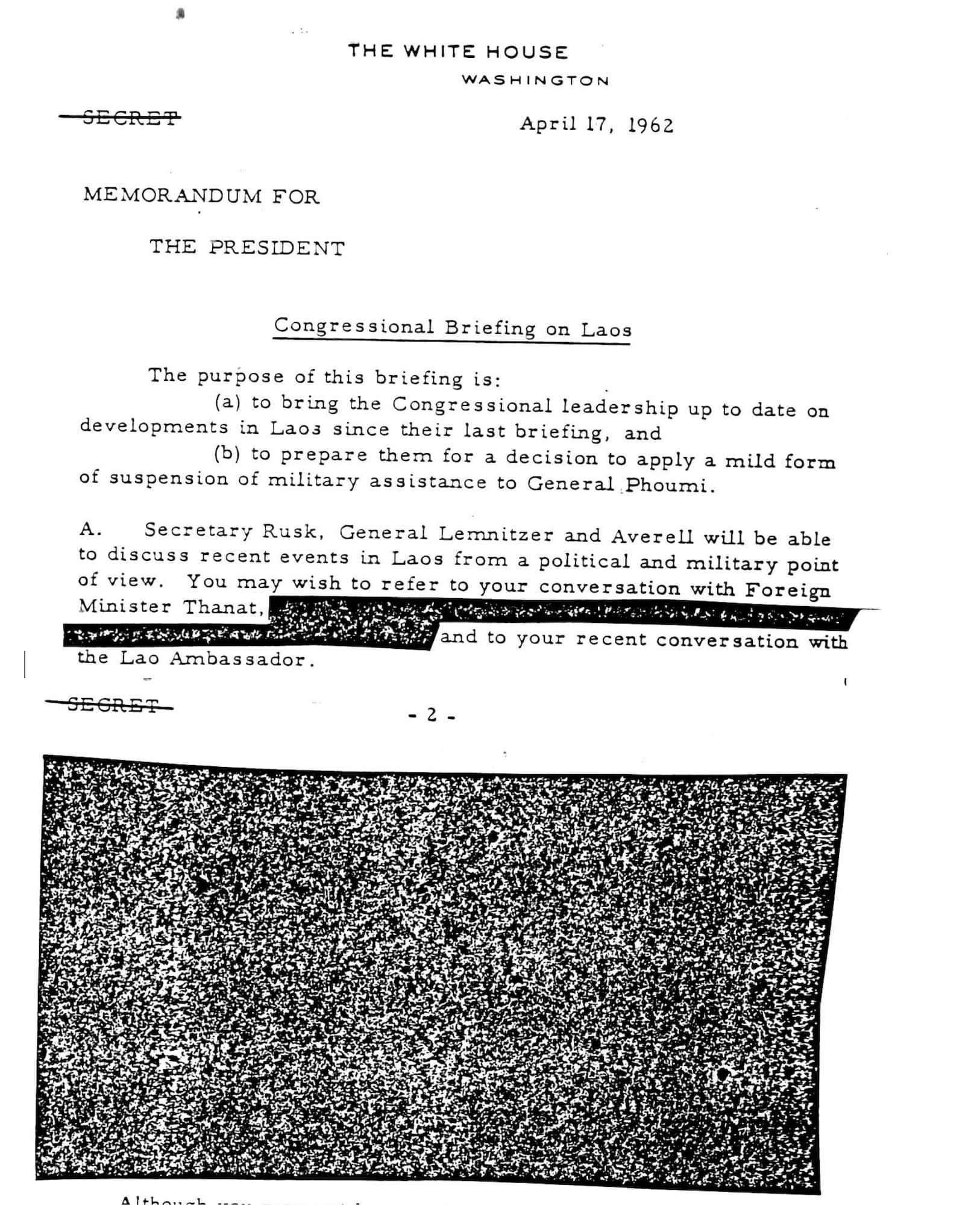 A typed memo addressed to JFK is titled "Congressional Briefing on Laos." Beneath, several lines are struck through in black marker to redact text.
