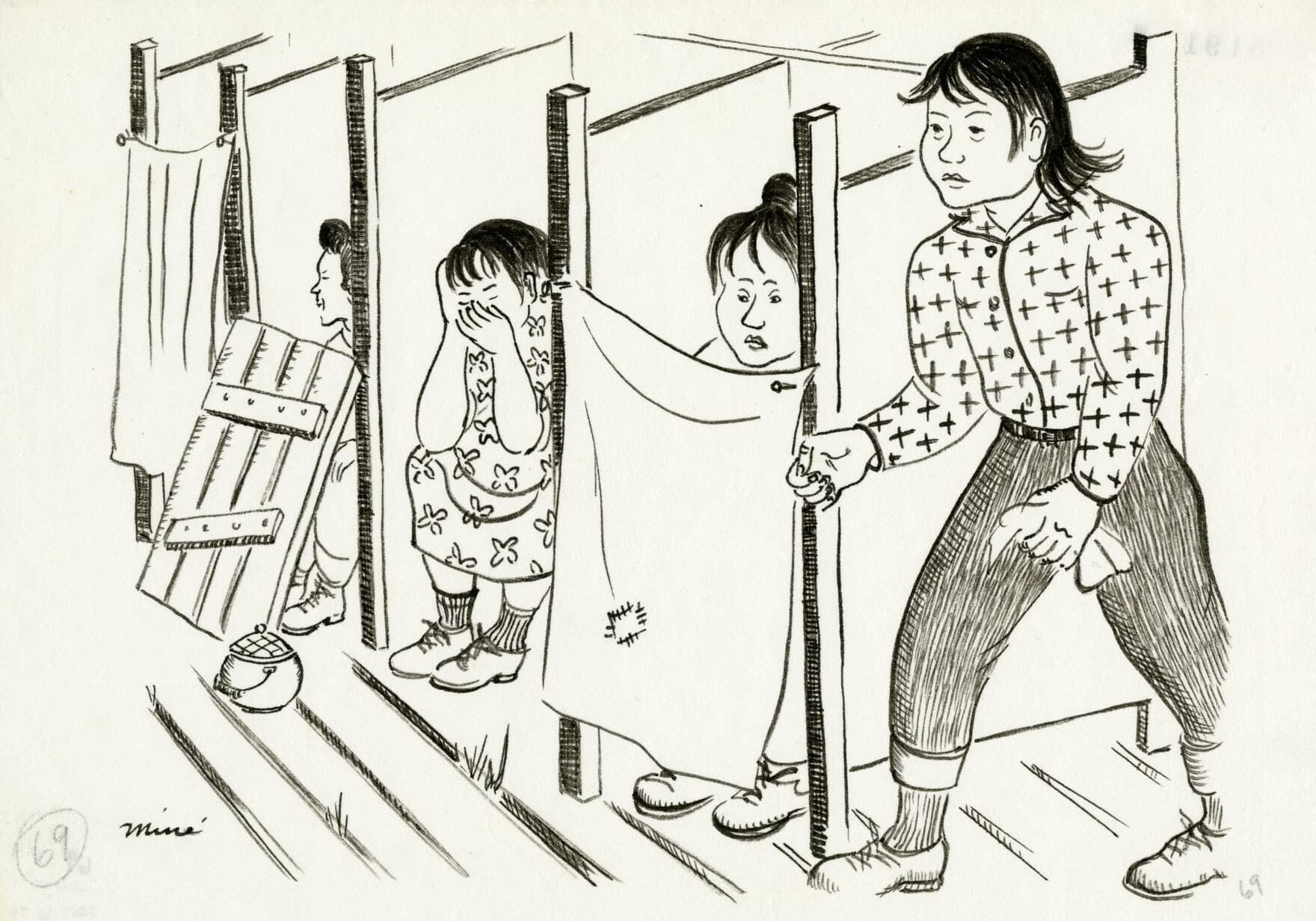 A woman in a cross-patterned top and jeans walks through the community toilet at the assembly center. Three women sit in stalls seeking privacy.