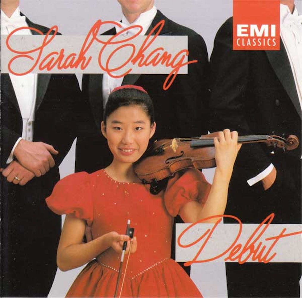 Album cover for Sarah Chang's Debut. Chang, a young Korean American girl wearing a red dress, poses with violin in front of three men in tuxedos.