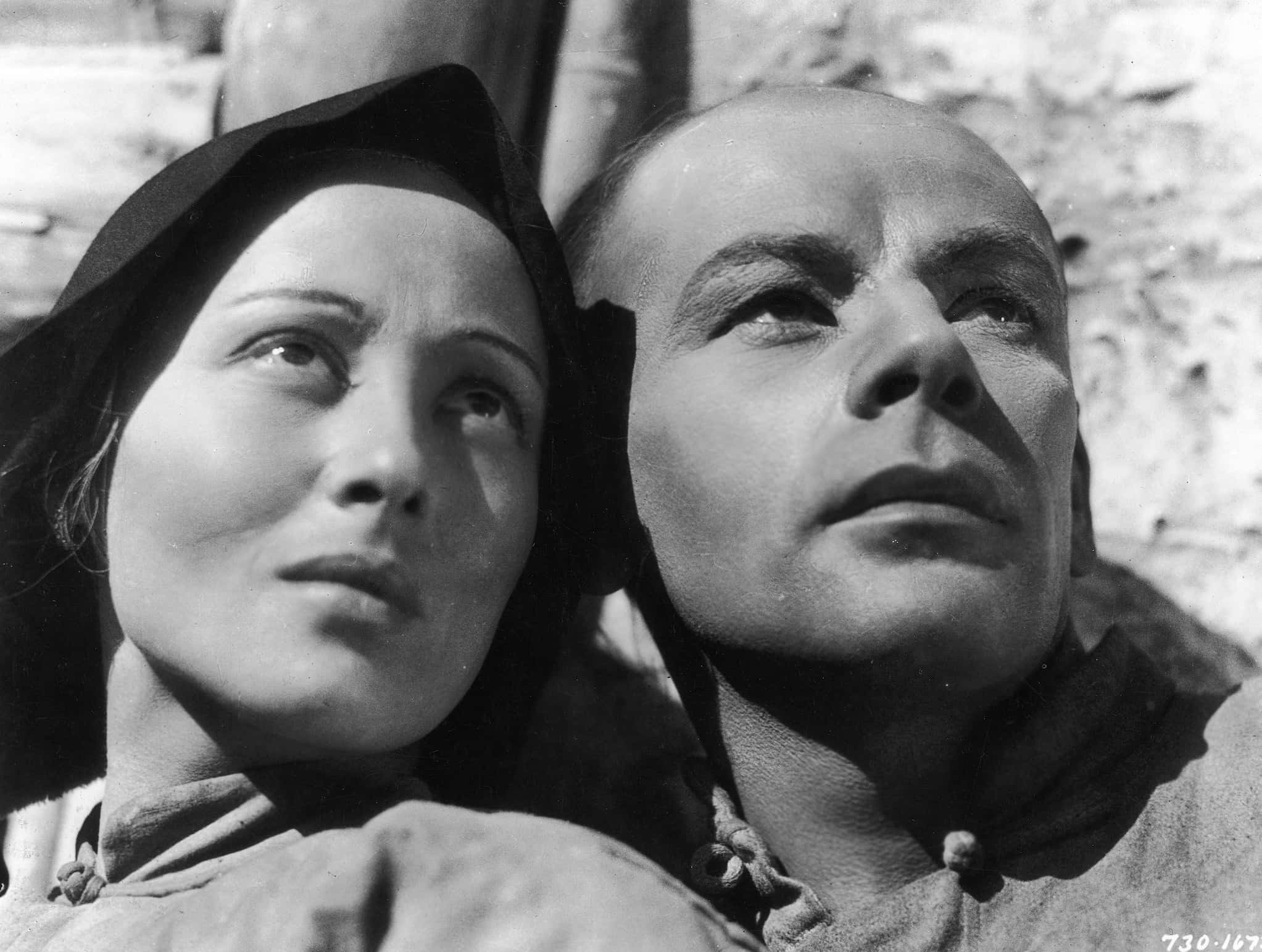 Close-up of German actress Luise Rainer and American actor Paul Muni as their characters in The Good Earth.