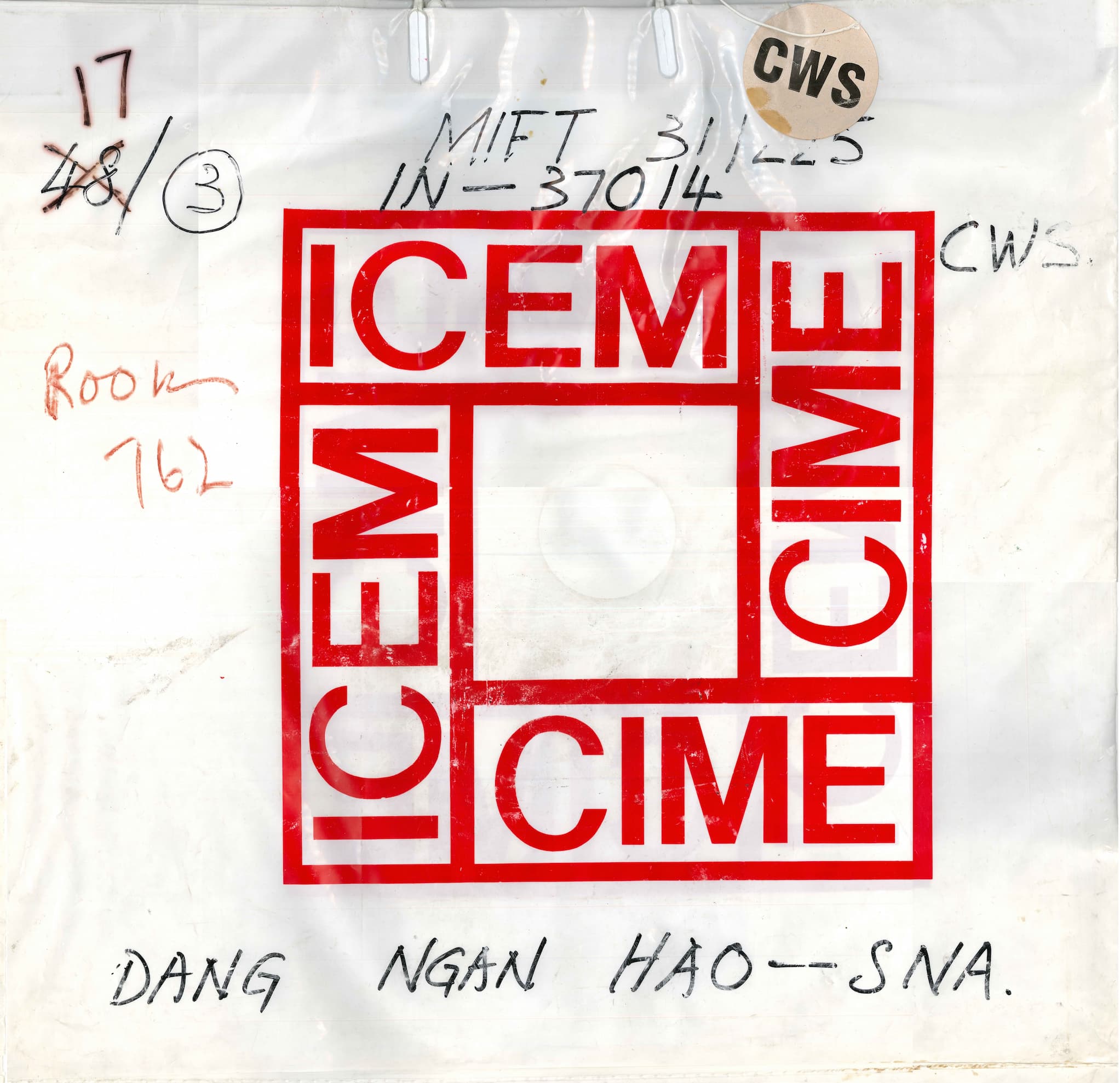 A plastic bag with a red square that reads "ICEM" four times. Inside are chest X-rays of Viet refugees.