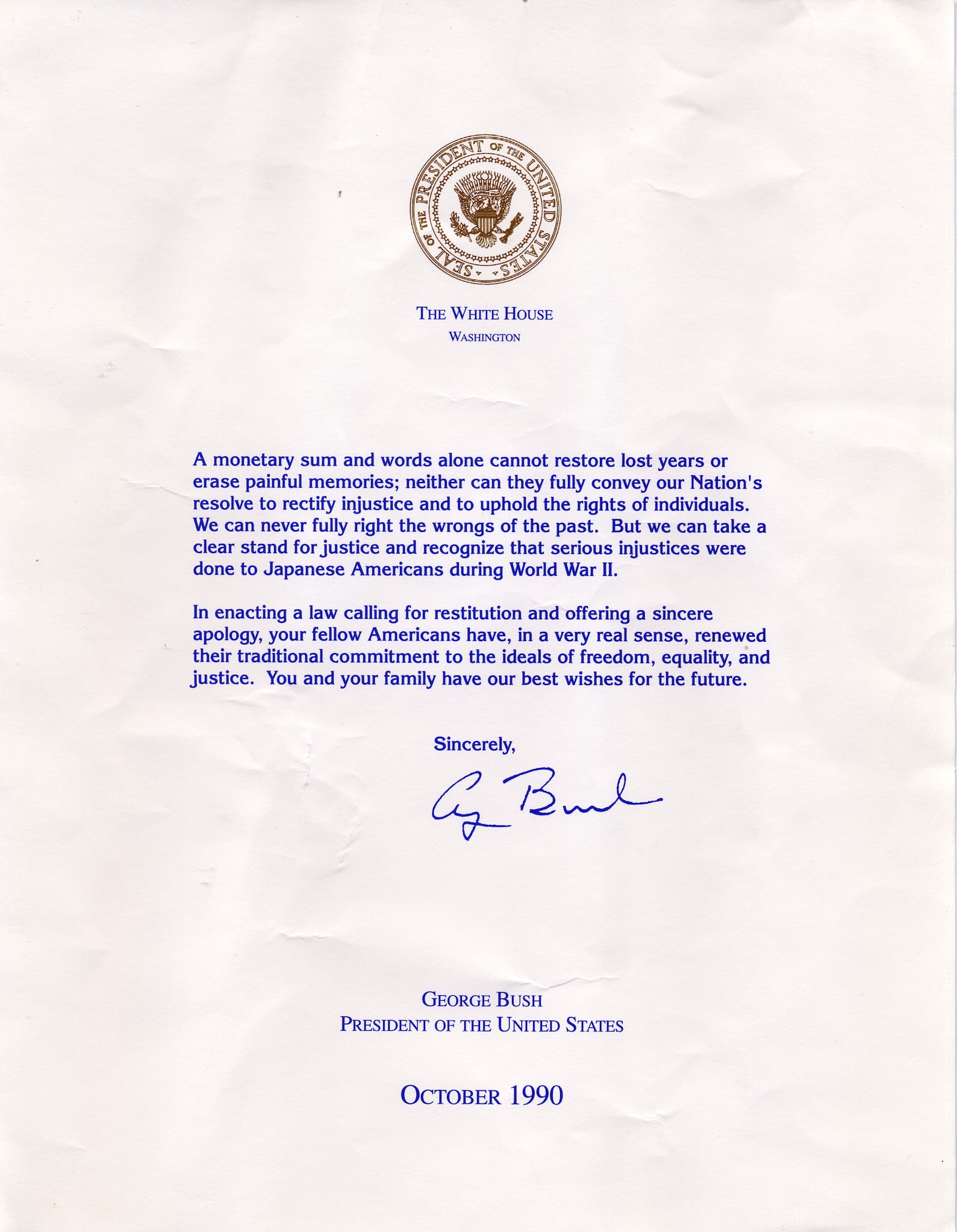 A written apology by President George Bush to the Japanese Americans imprisoned during World War II along with reparations.