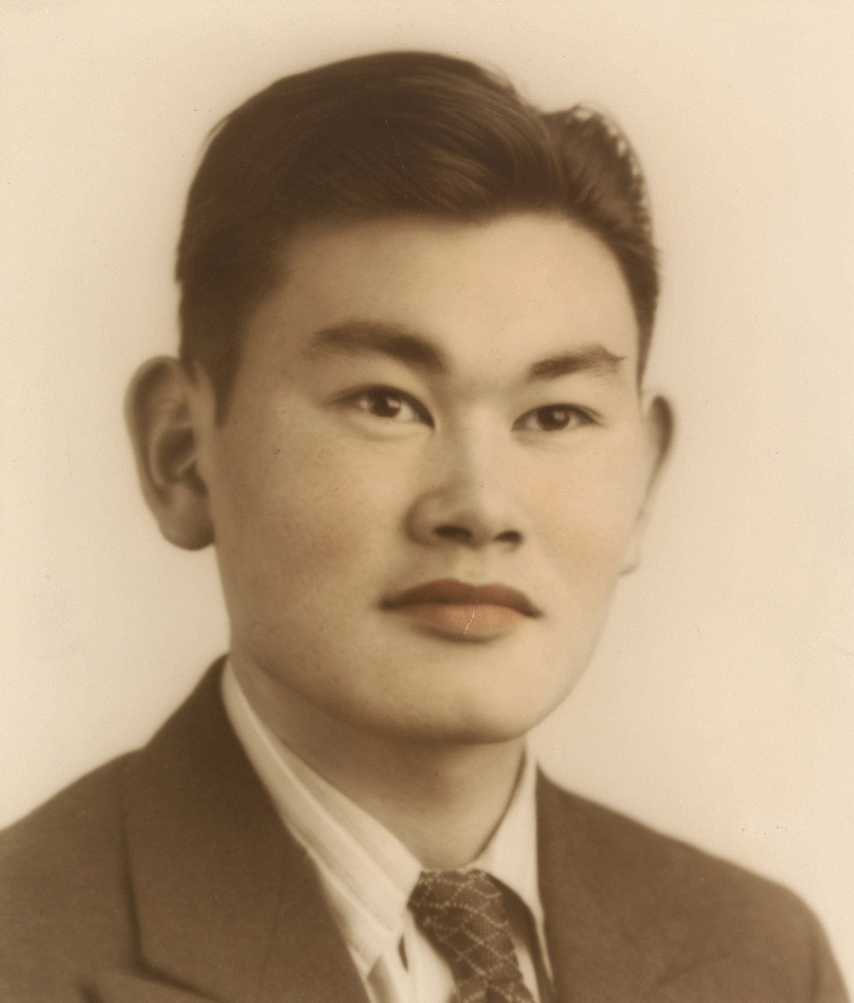 A portrait of a young Japanese American activist Fred Korematsu.