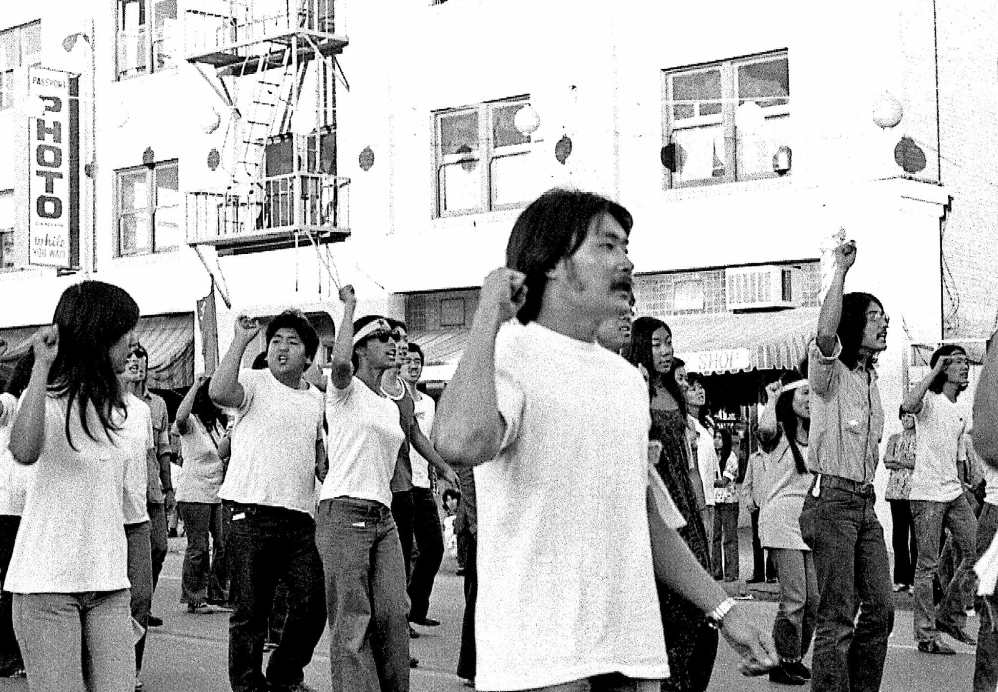 A group of Japanese American activists from the Van Troi Youth Brigade march during a demonstration.