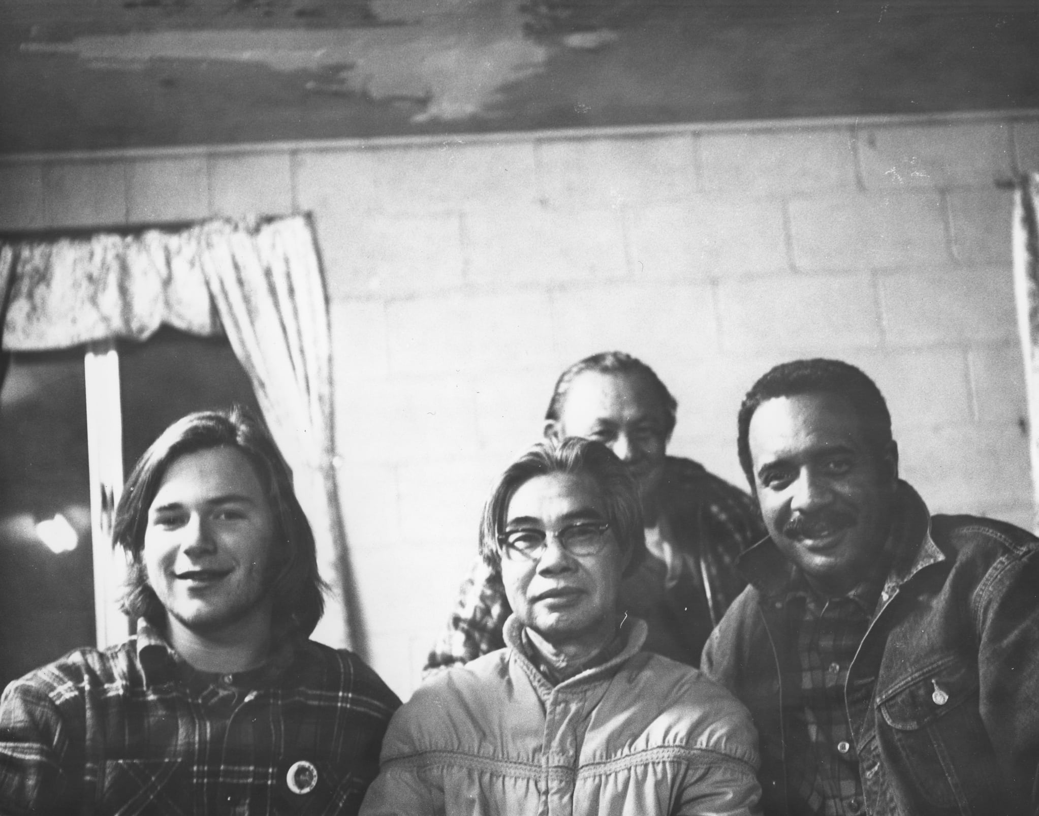 Philip Vera Cruz and three unidentified men at a boycott meeting.