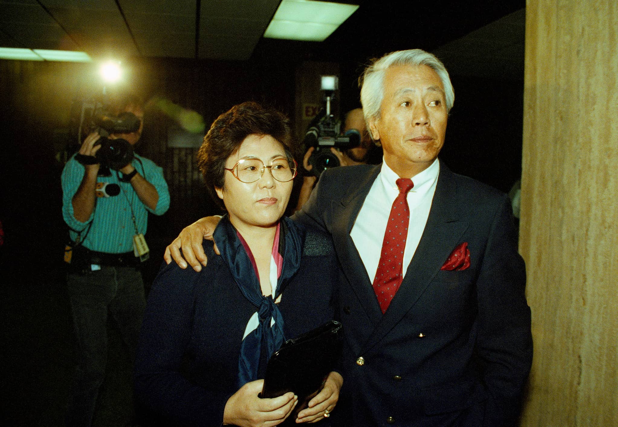 Soon Ja Du, a Korean store keeper who fatally shot teenager Latasha Harlins, exits court with her husband by her side.