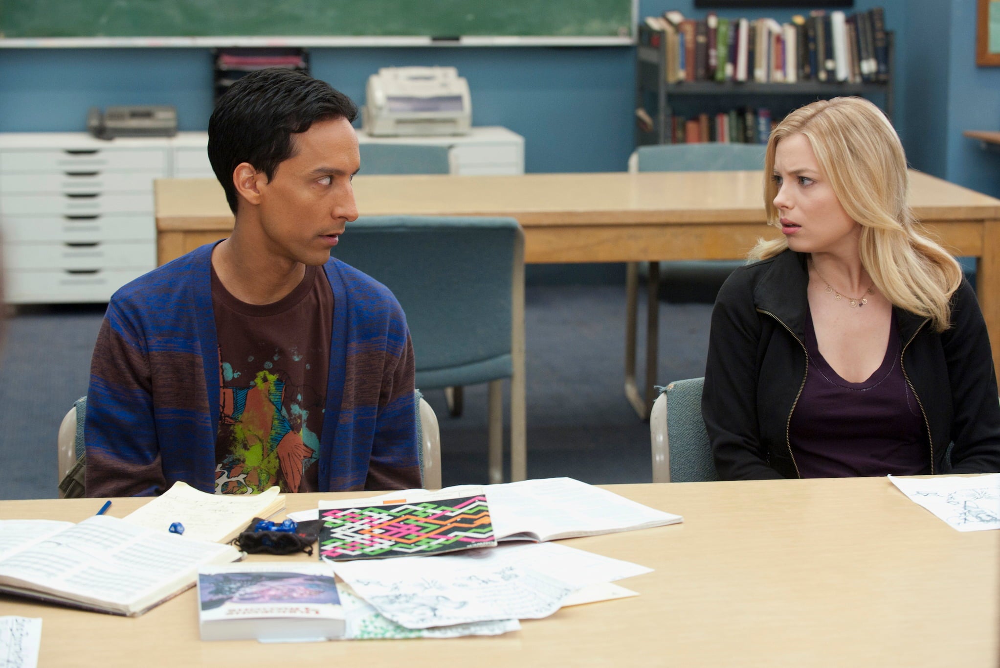 Mixed race character Abed, a Palestinian-Polish American man, sits beside Britta, a white, blonde woman, in community college classroom.