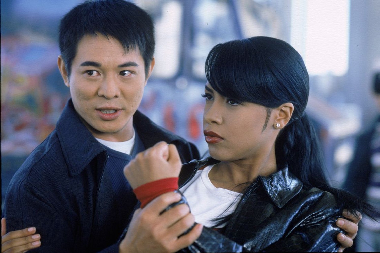 Jet Li holds Aaliyah's wrist while she makes a fist for the 2000 film Romeo Must Die.
