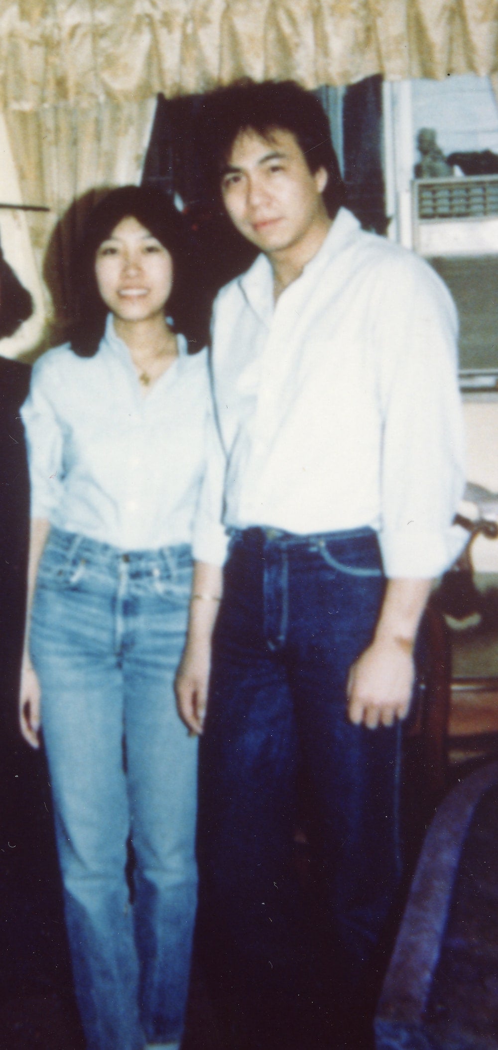 Vincent Chin, a Chinese American man in white shirt and dark-washed jeans, with Vikki Wong, a woman in light blue shirt and light-washed jeans.