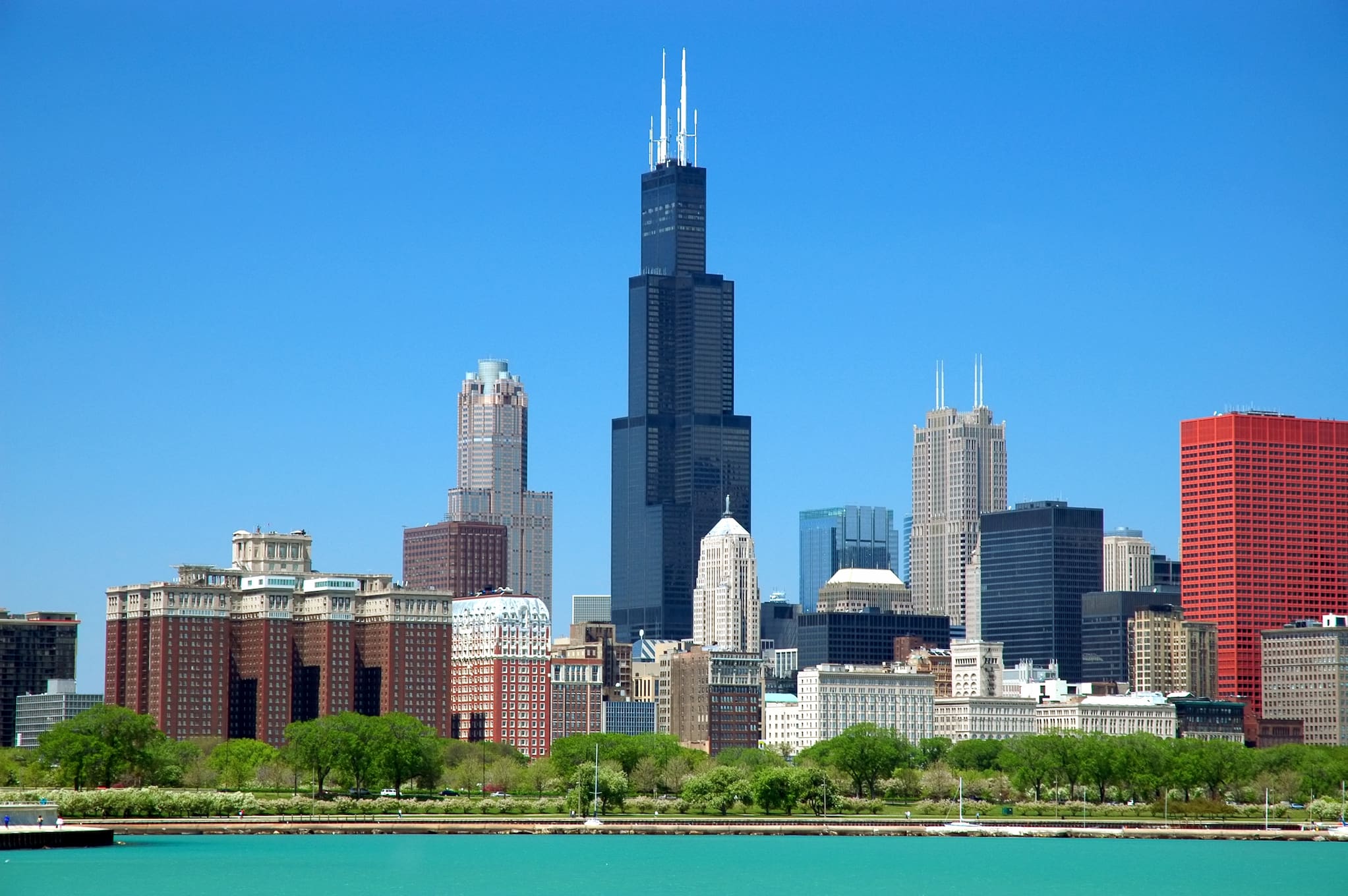 Skyline view of the Sears Tower and other buildings in Chicago, Illinois on a clear and cloudless day.