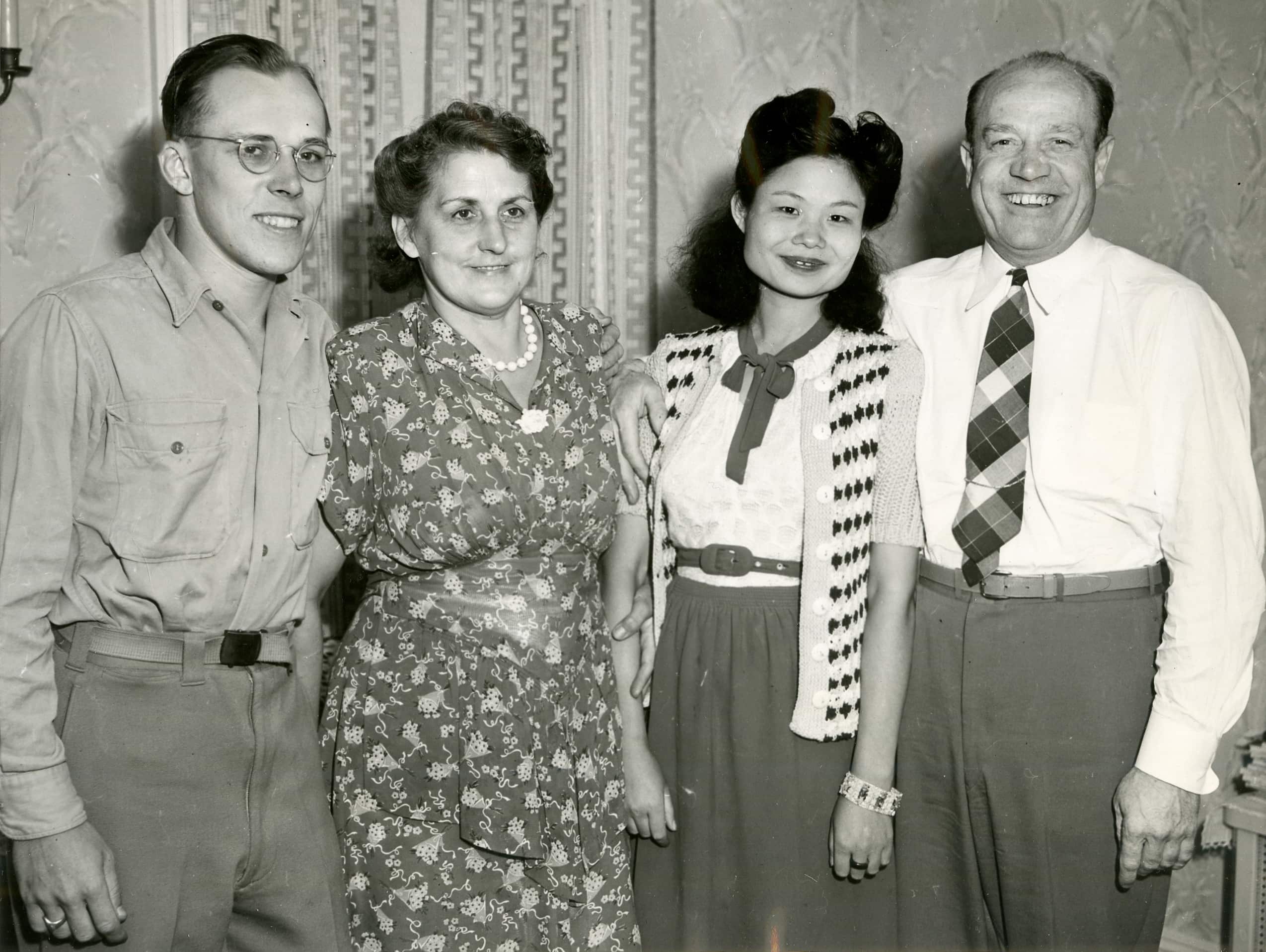 A 1946 ACME Newspictures photo depicting a former soldier Frank H. Rathbone introducing his new Chinese wife Wu Shih-San Rathbone to his parents.
