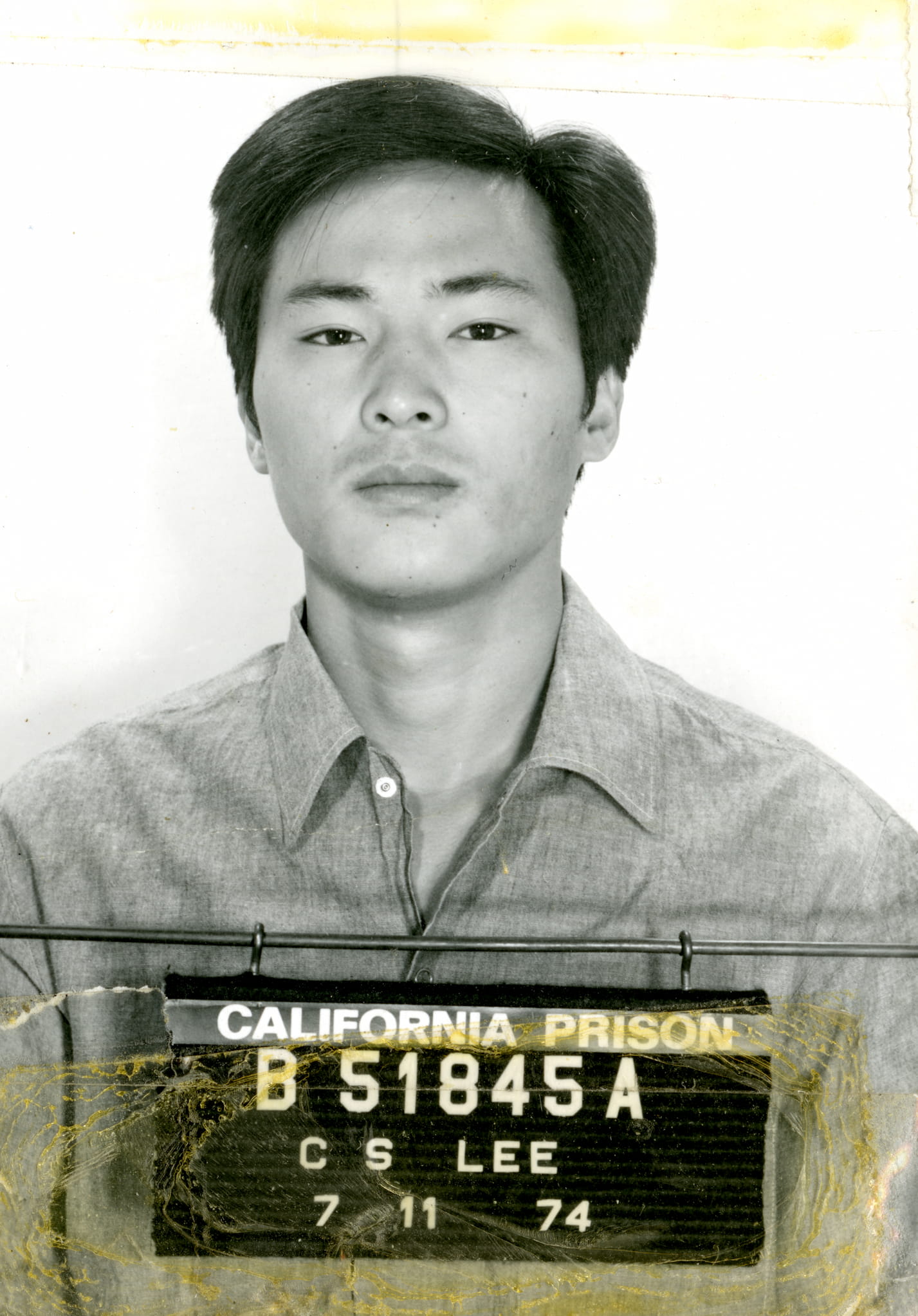 Mugshot photo of Chol Soo Lee. Below is his booking id that reads "California Prison B51845A CS Lee".